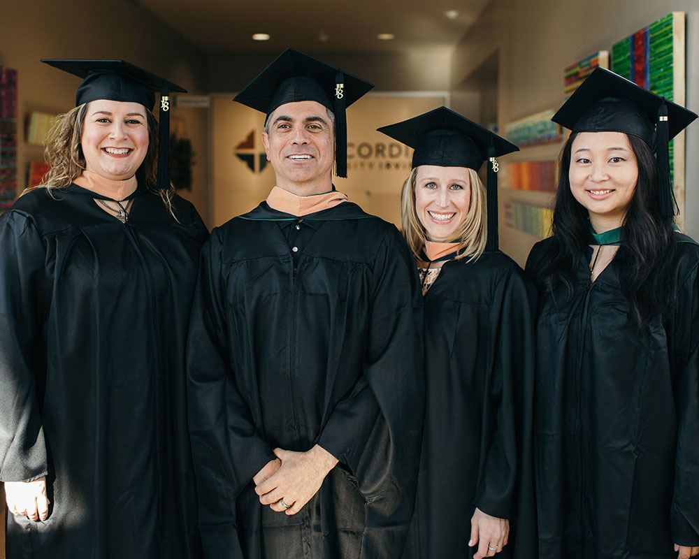 MBA graduates in their cap and gowns