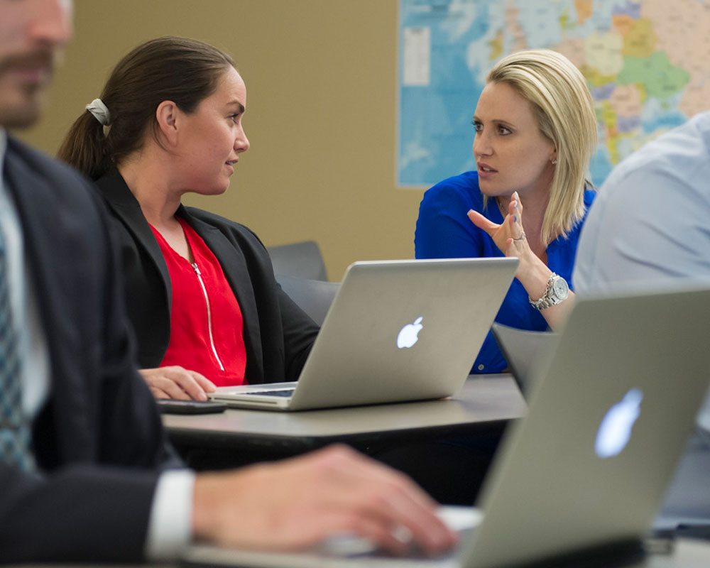 Women working together in class