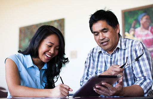 Dr. Eugene Kim helping a student