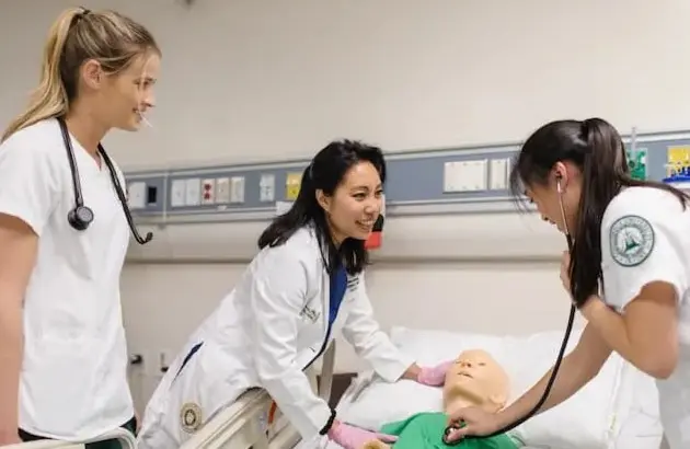 Nursing students with Doctor and dummy patient