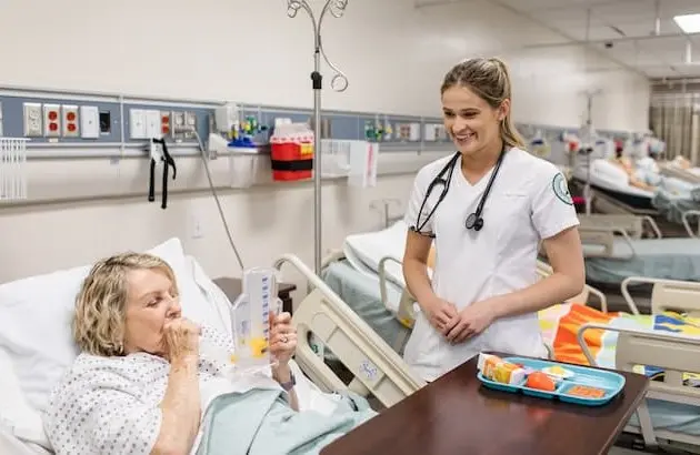 Nursing Student working with patient