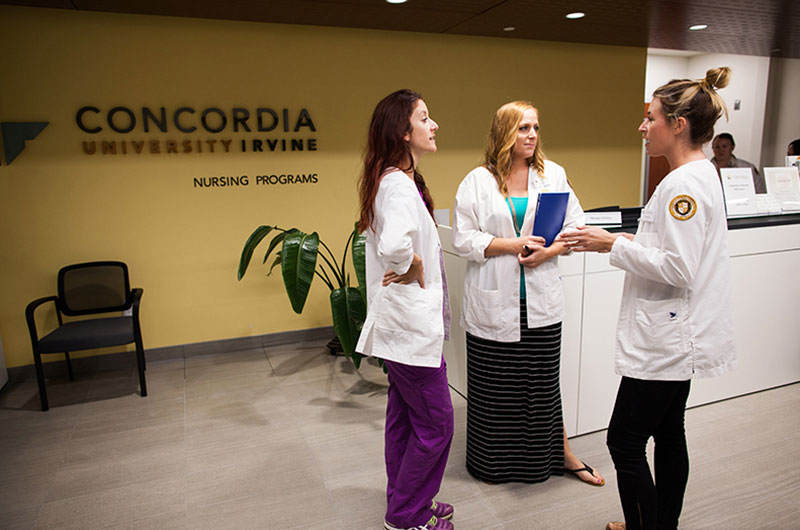 Nursing students standing in the lobby of the Park Place campus