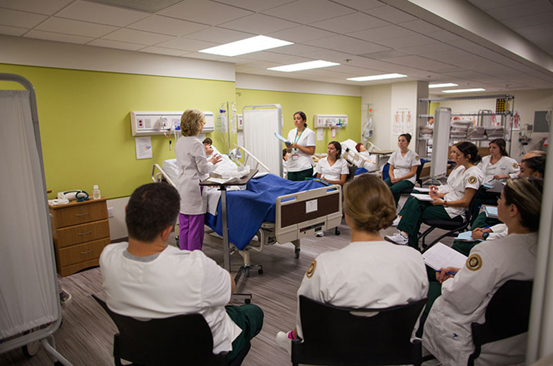 Nursing students watching a demonstration