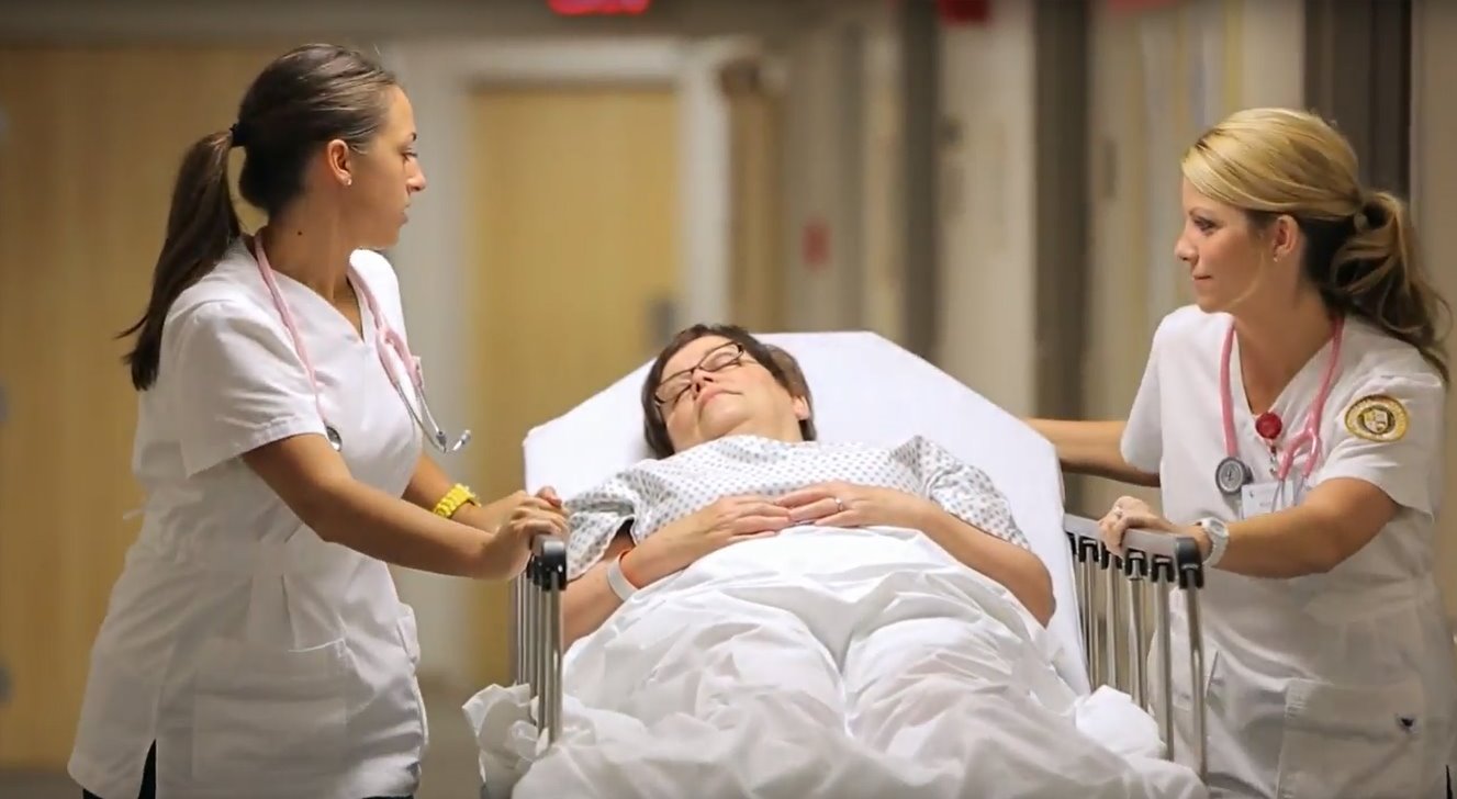 Nurses treat elderly patient