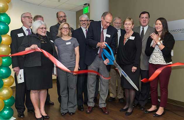 President Krueger cutting the red tape for Park Place campus.