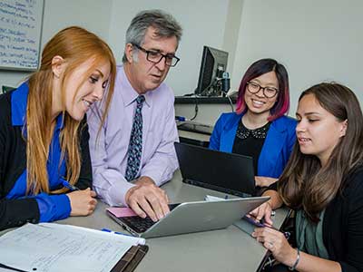 students and professor from the CUI school of business