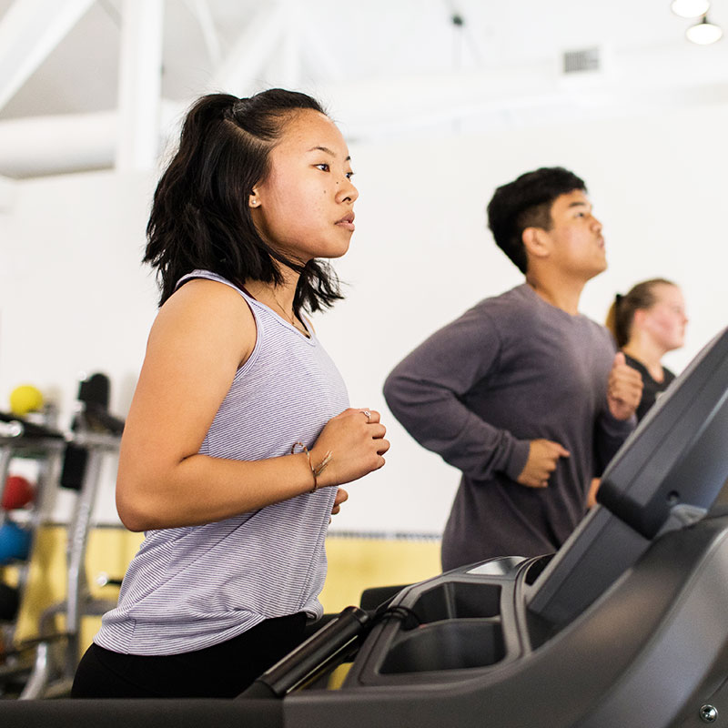 Female on a treadmill in the CU Active Fitness Center
