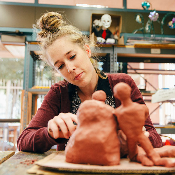 Female student working on a sculpture