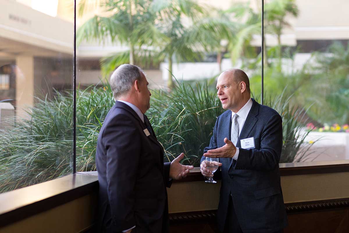 Two attendees having a conversation