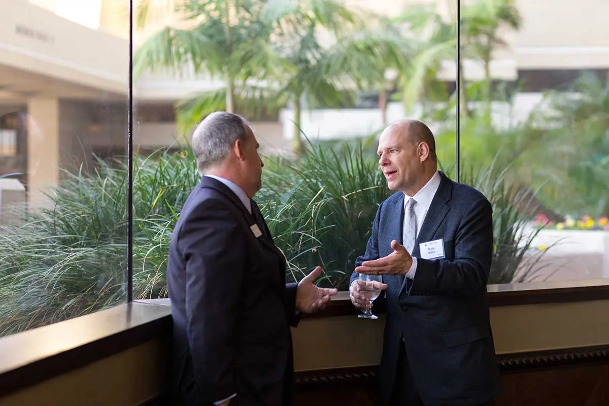 Two attendees having a conversation