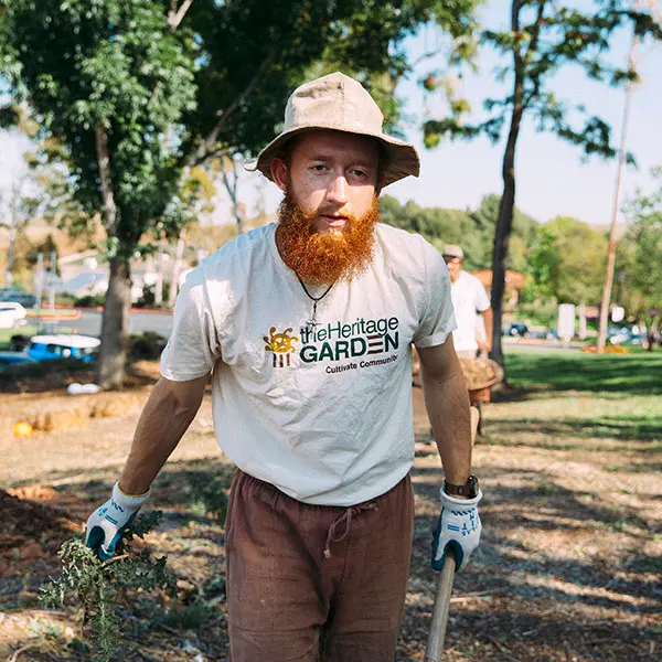 Male student working in the Heritage Garden