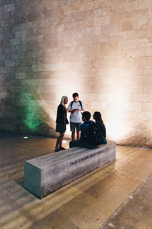 CUI students on campus vertical