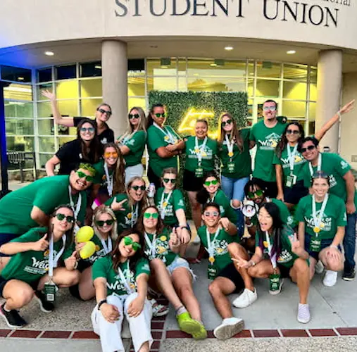 Student posing for a photo outside Student Union