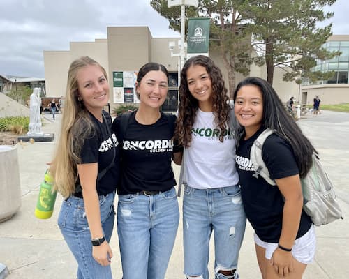 Four girls smiling for a photo