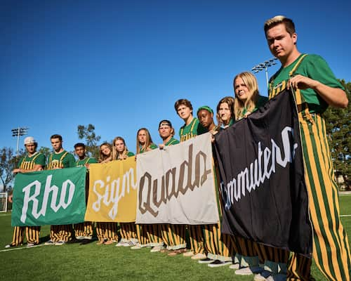 A group of people holding up flags