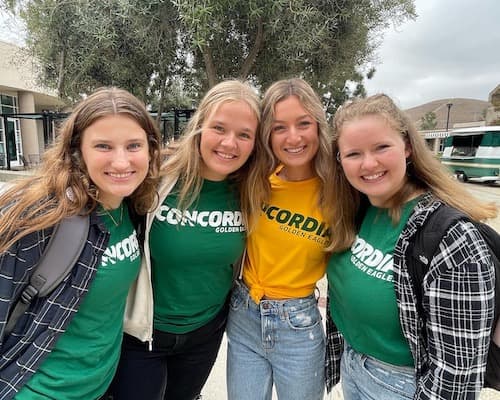 Four girls smiling for a photo