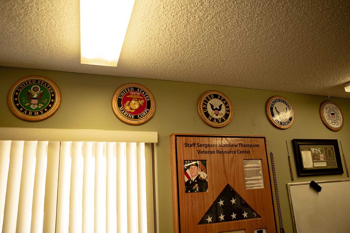 Military branches hanging on the wall