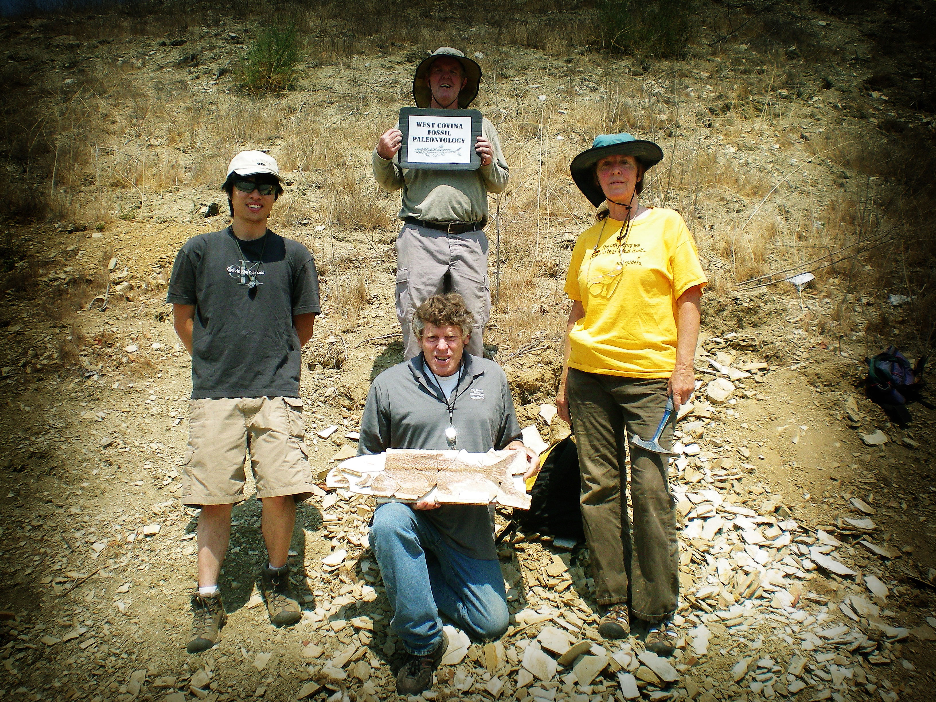 WCFP Group posing with a fossil