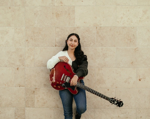 Majo posing in front of Concordia's BMC