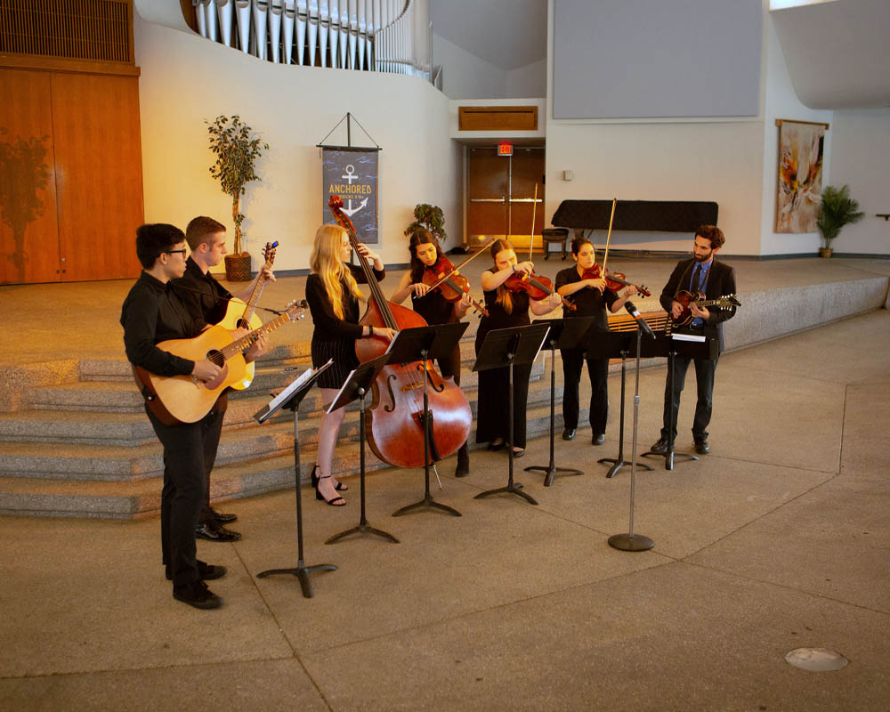 Gallarey image of string instruments in concert hall
