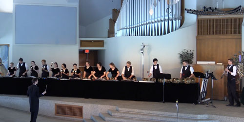 handbell performers in the CU center