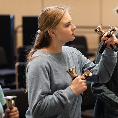 Concordia Student playing handbells