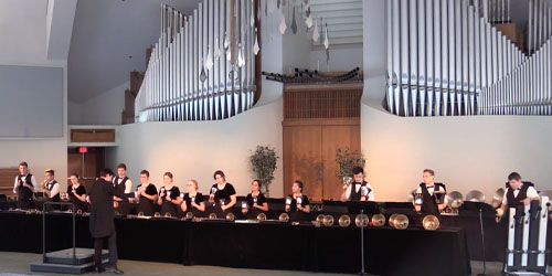 handbell performers in the CU center