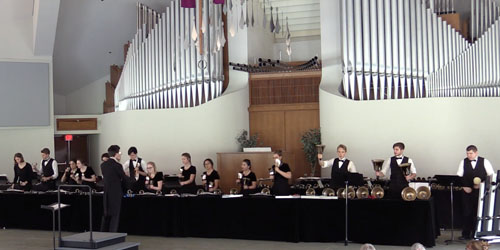 handbell performers in the CU center