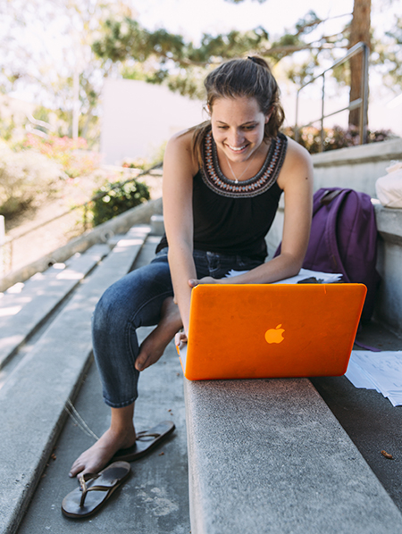 Female student sitting outside in the ampitheatre