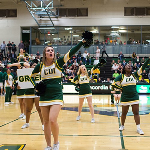 CUI Cheer and Stunt performing for the fans