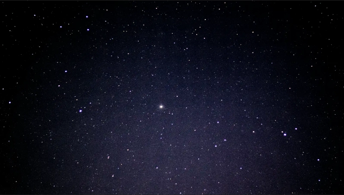 A vast starry sky filled with numerous stars twinkling against a dark backdrop.