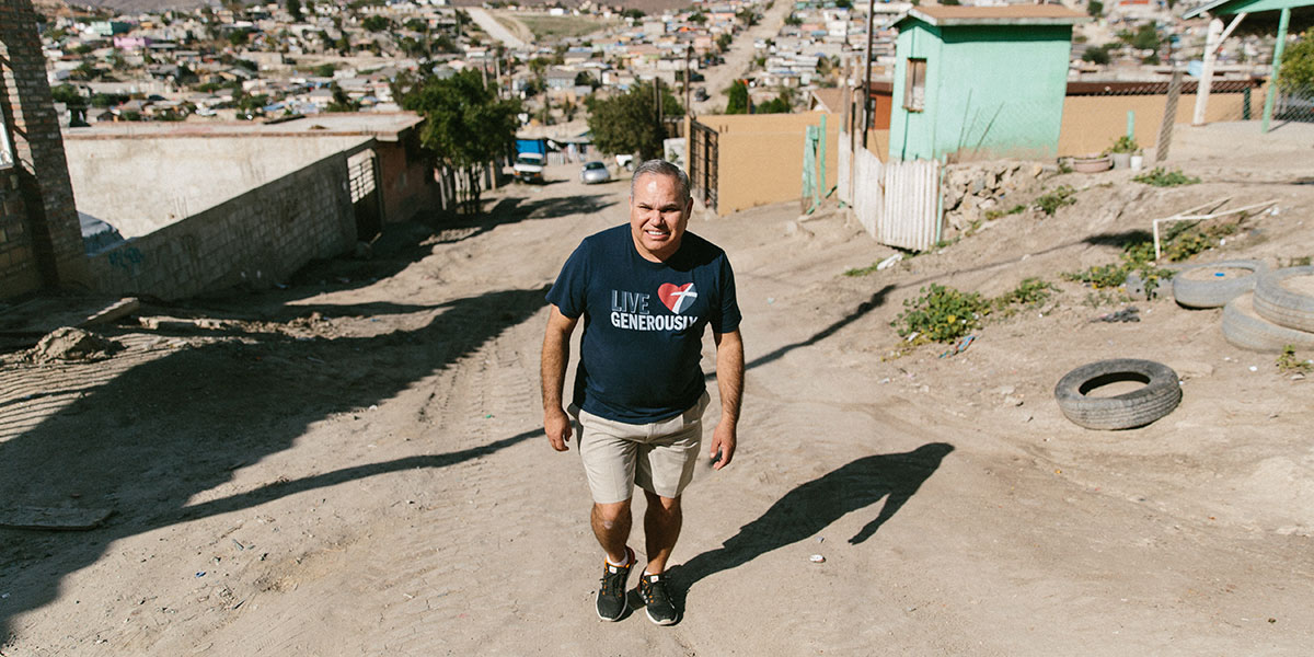 Ramon walking through a neighborhood in Mexico