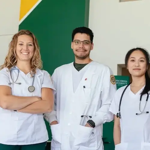 Three nurses standing and smiling
