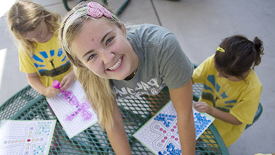 Maddie working with kids