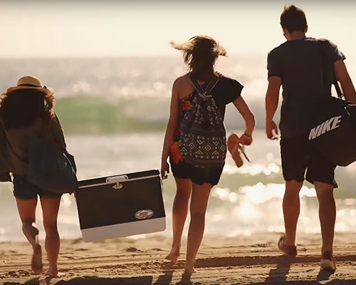 Students walking up to the beach