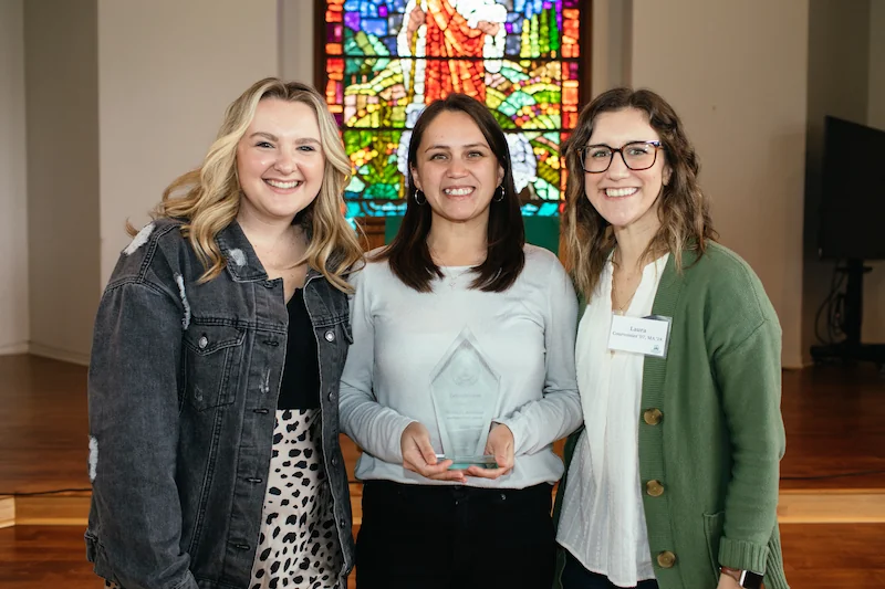 Celina receiving her alumni award