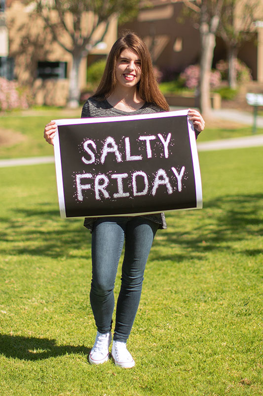 Emily McCarthy holding one of her projects