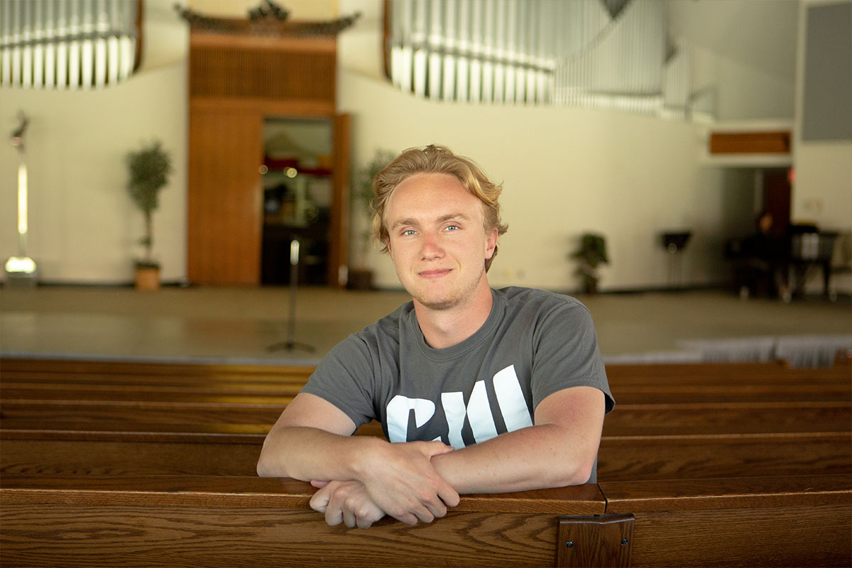 Nathan MacGregor sitting in the CU Center