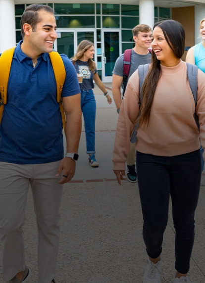 Concordia students walking outside the main building