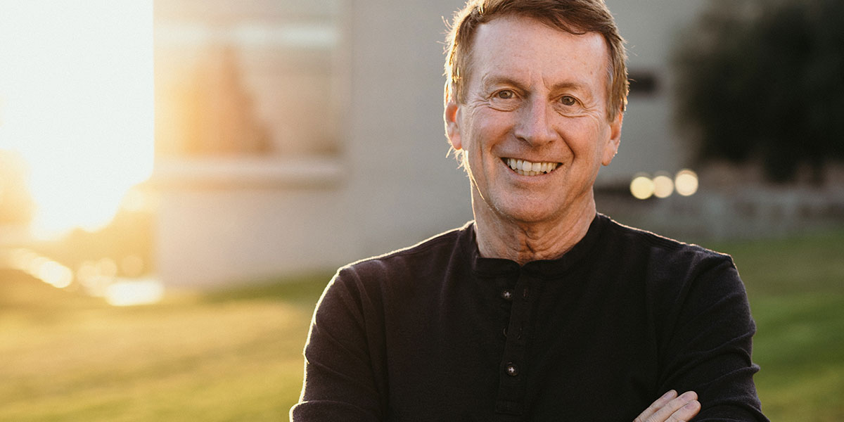 John Townsend outside Grimm Hall at sunset