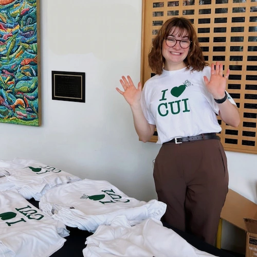 Student passing out I Heart CUI shirts