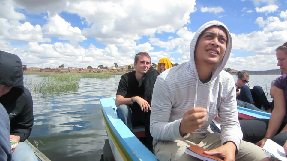 Students sitting on a boat