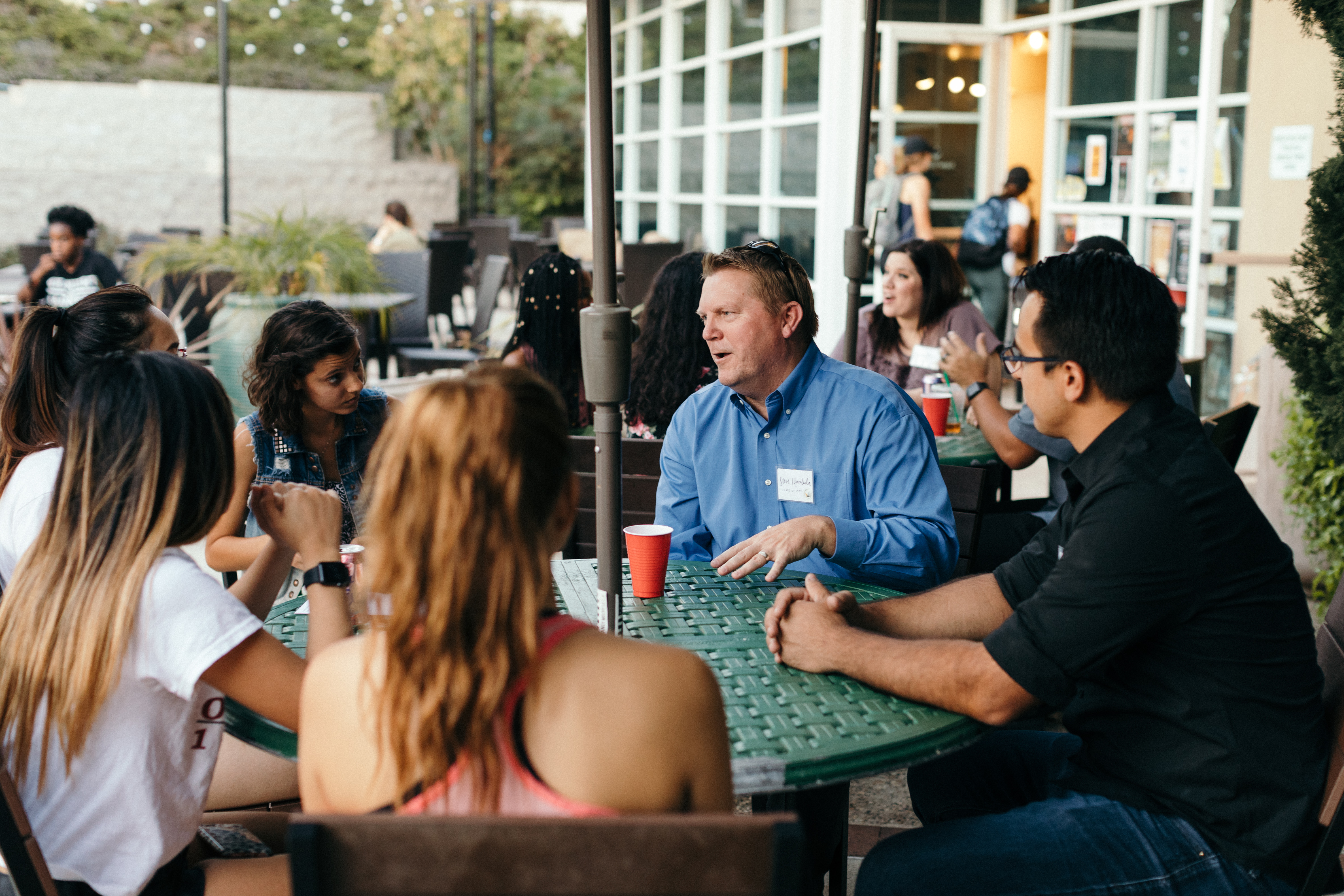 A group of people sitting at a table