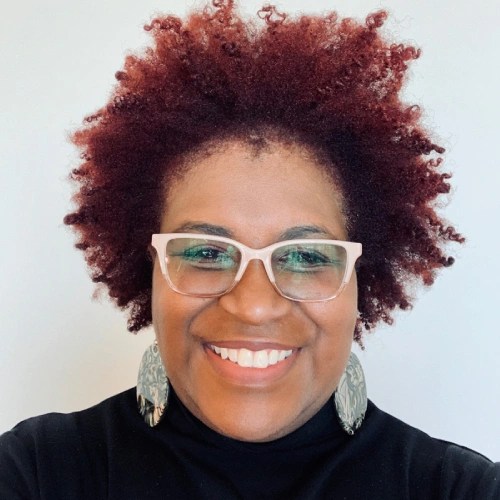 A woman smiling for a selfie