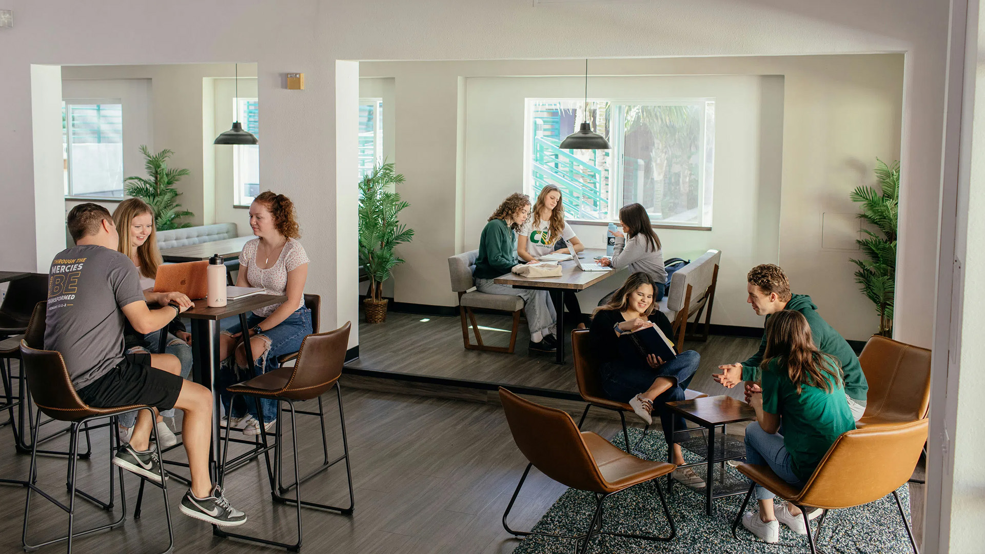A group of people sitting at tables in a room