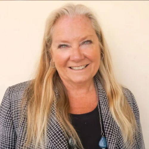 A woman smiling at the camera