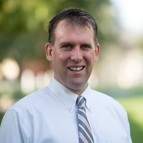 A man in a white shirt and tie