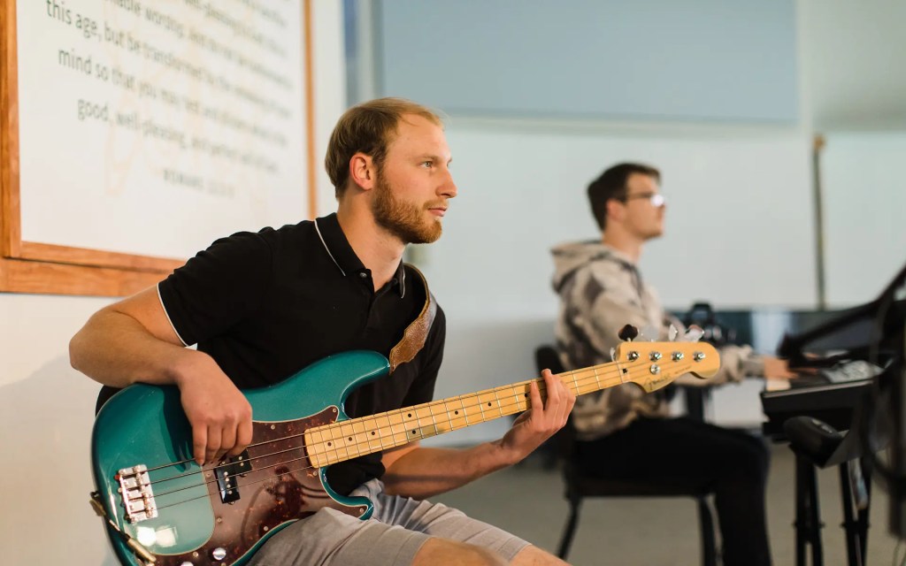 A man holding a guitar