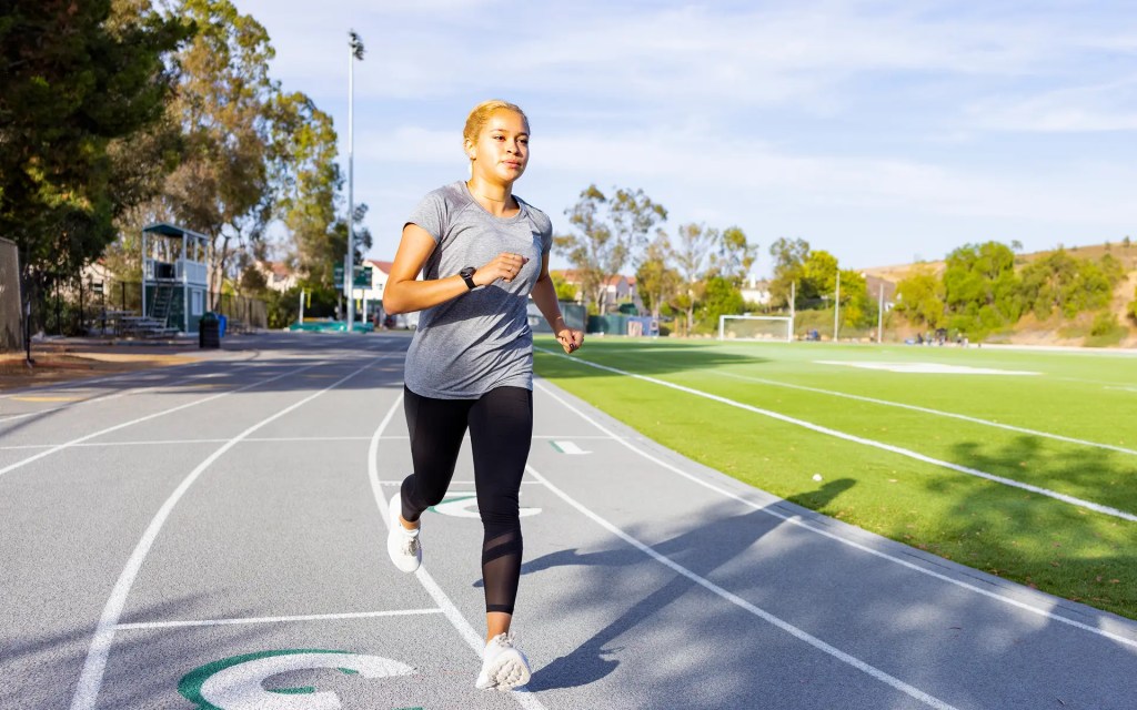 A woman running on a track