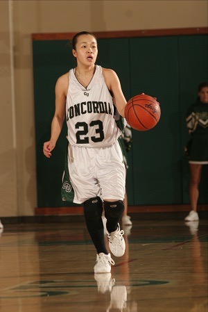 A basketball player dribbling a basketball